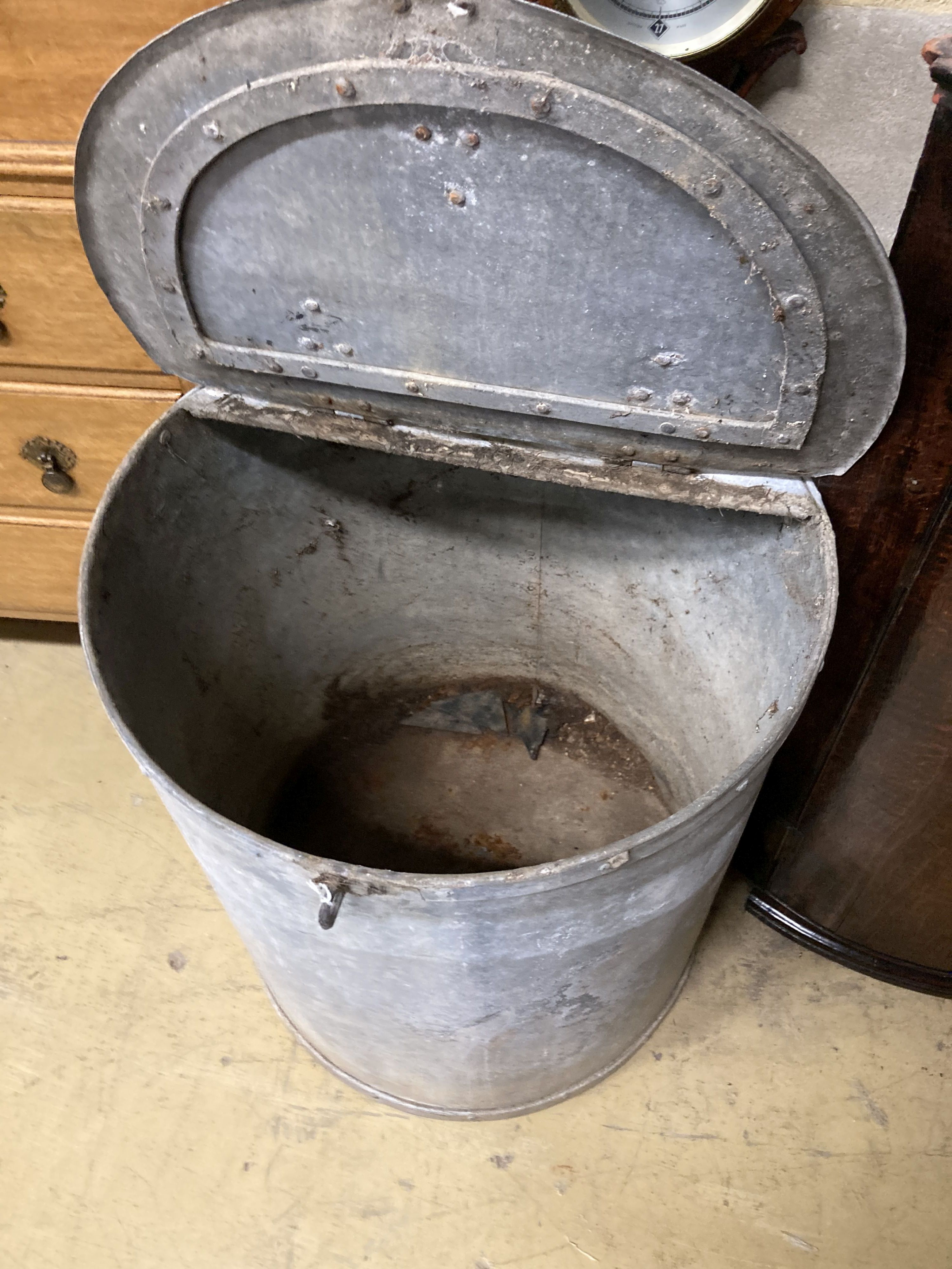 A large Victorian circular galvanised lidded barrel, 66cm high, 58cm diameter